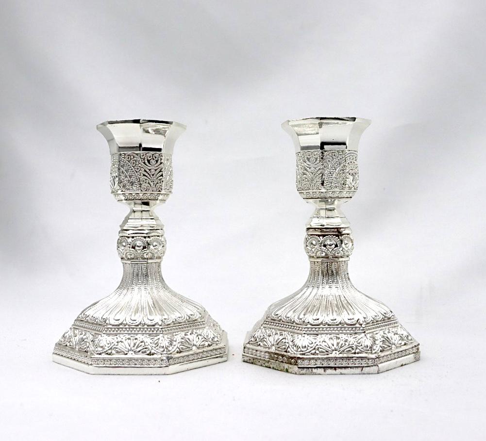 A pair of designed silver candlesticks