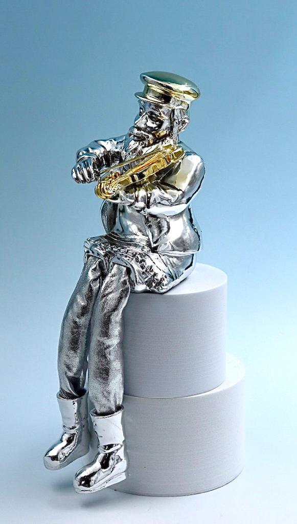 A seated Hasidic playing a violin, made of electroformed silver plating and gold plating.