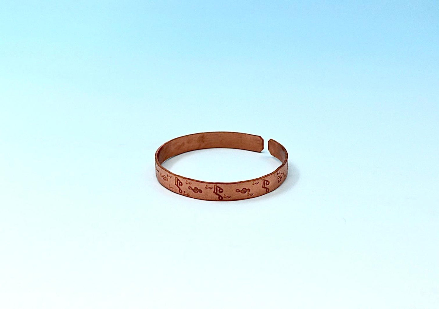 copper bracelet with music notes