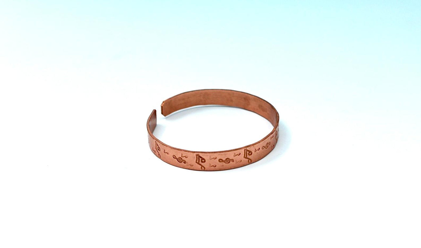 copper bracelet with music notes