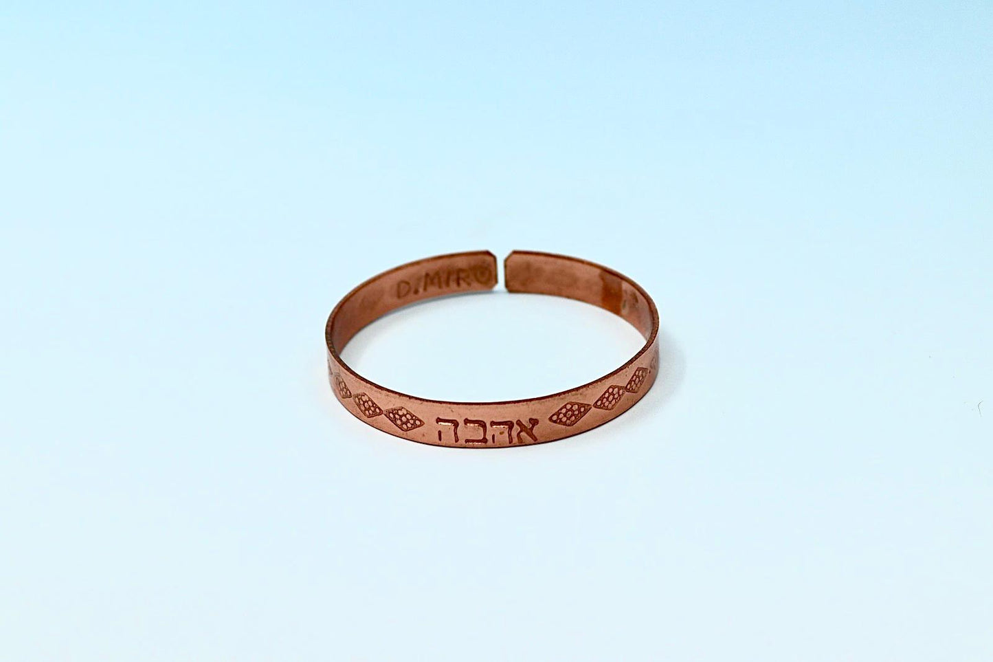 copper bracelet written:״LOVE ״ in Hebrew