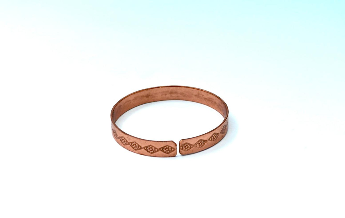 copper bracelet written:״LOVE ״ in Hebrew