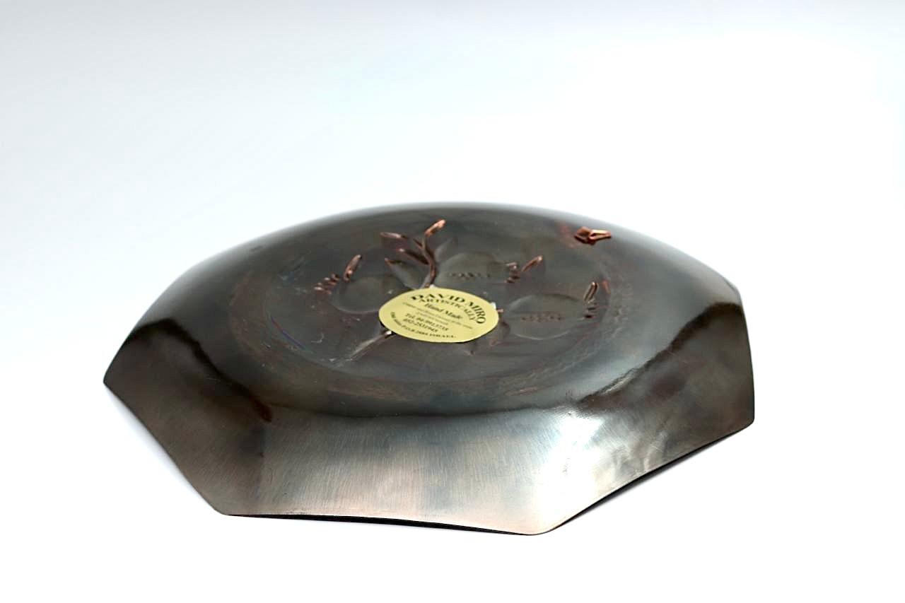 Copper hammering of pomegranates, partially blackened