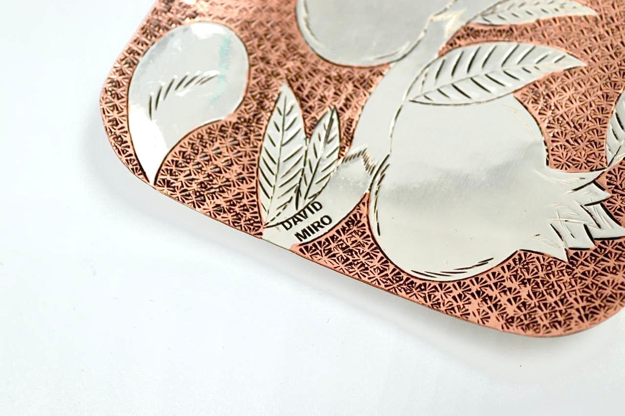 Handmade copper and silver hammering of the Star of David, pomegranates and the word love in Hebrew