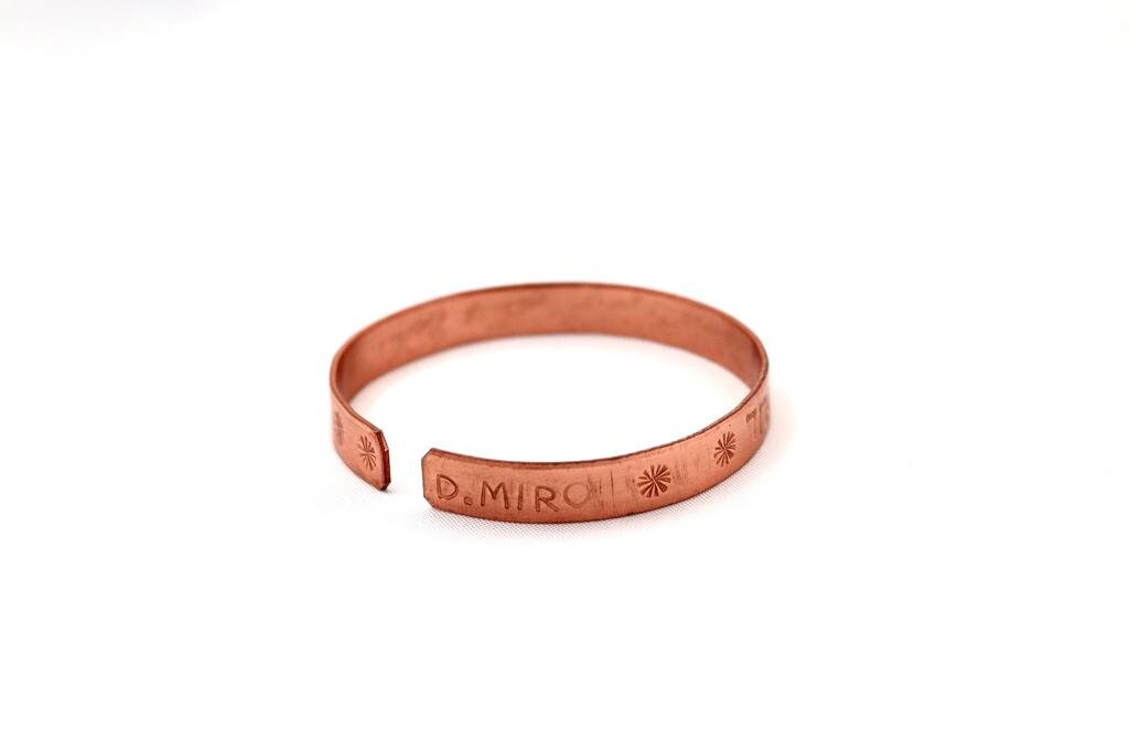 copper bracelet with:״Hear O Israel, the Lord our God the Lord is One״ in Hebrew