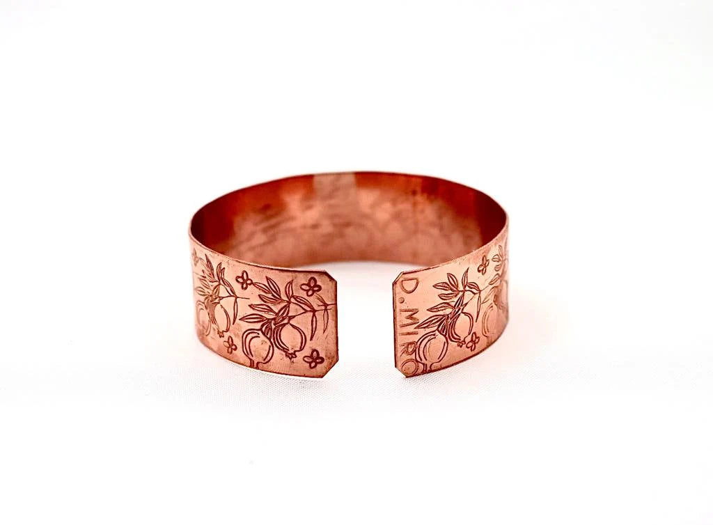 Handmade copper bracelet engraved with pomegranates