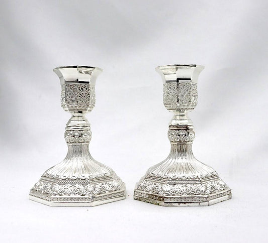 A pair of designed silver candlesticks