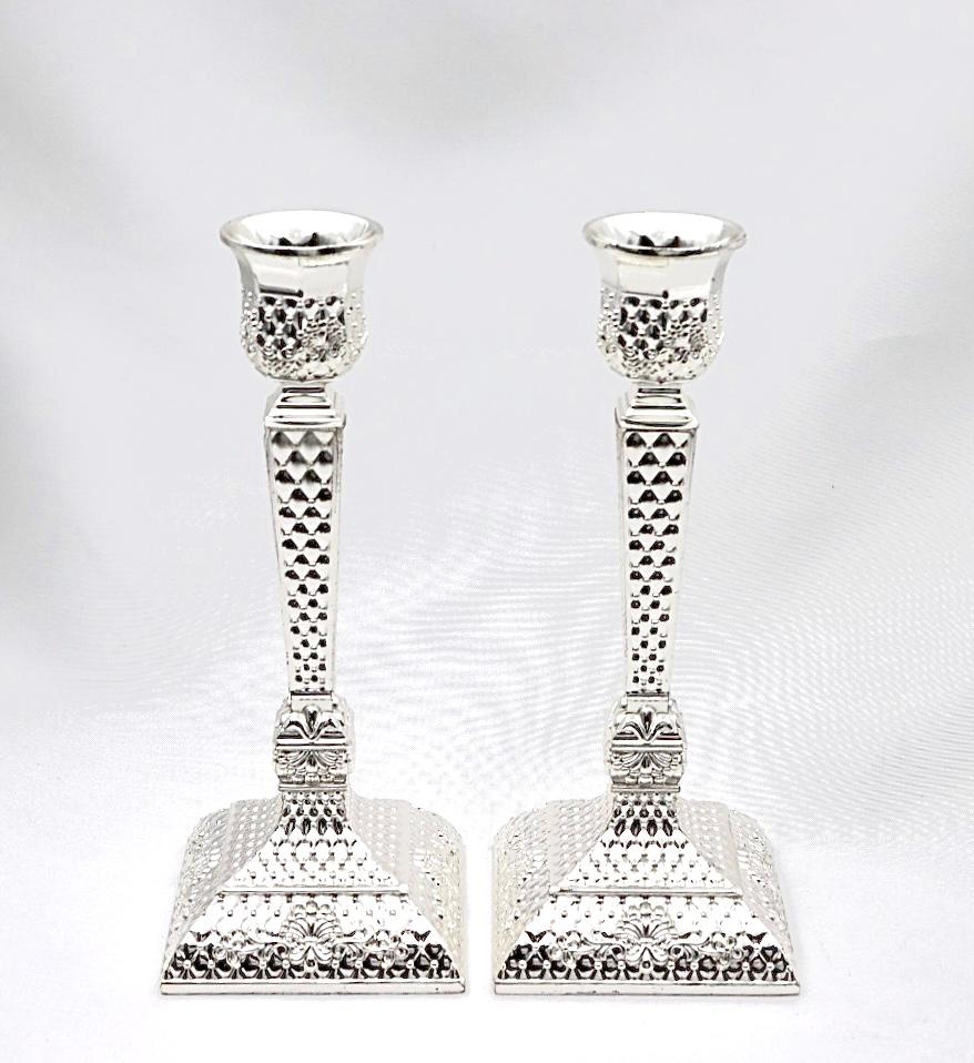 A pair of designed silver candlesticks