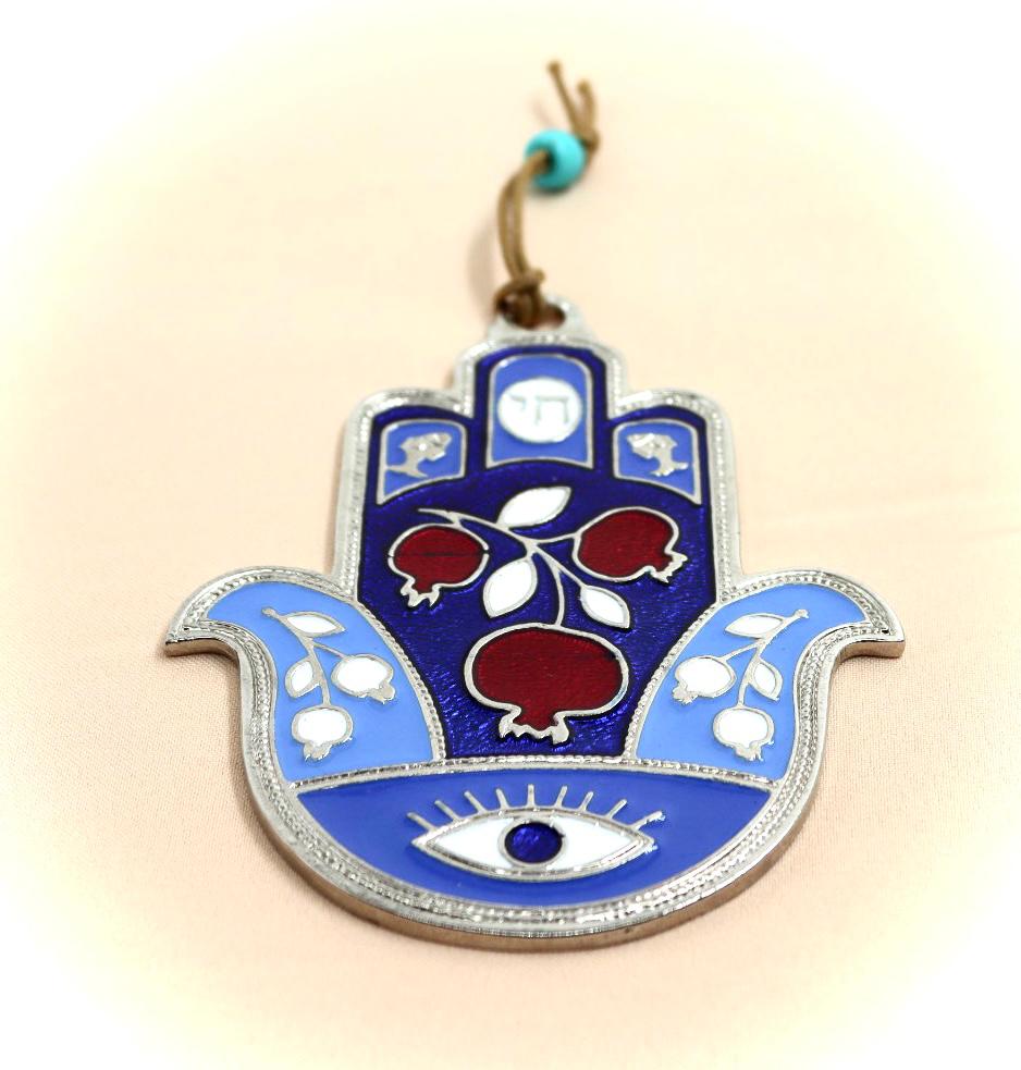 hamsa designed with pomegranate and an eye against the evil eye.