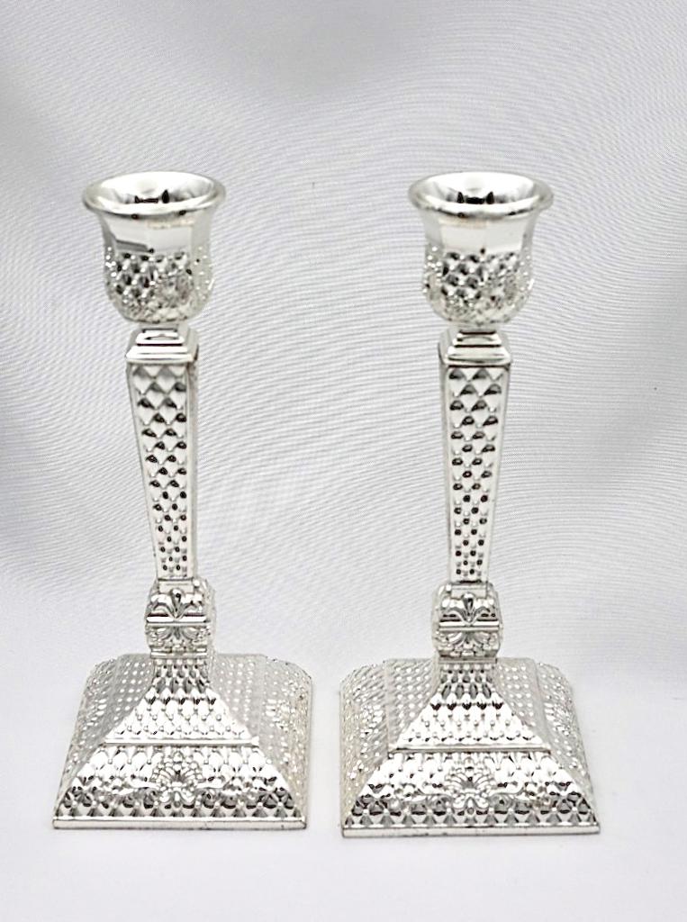 A pair of designed silver candlesticks