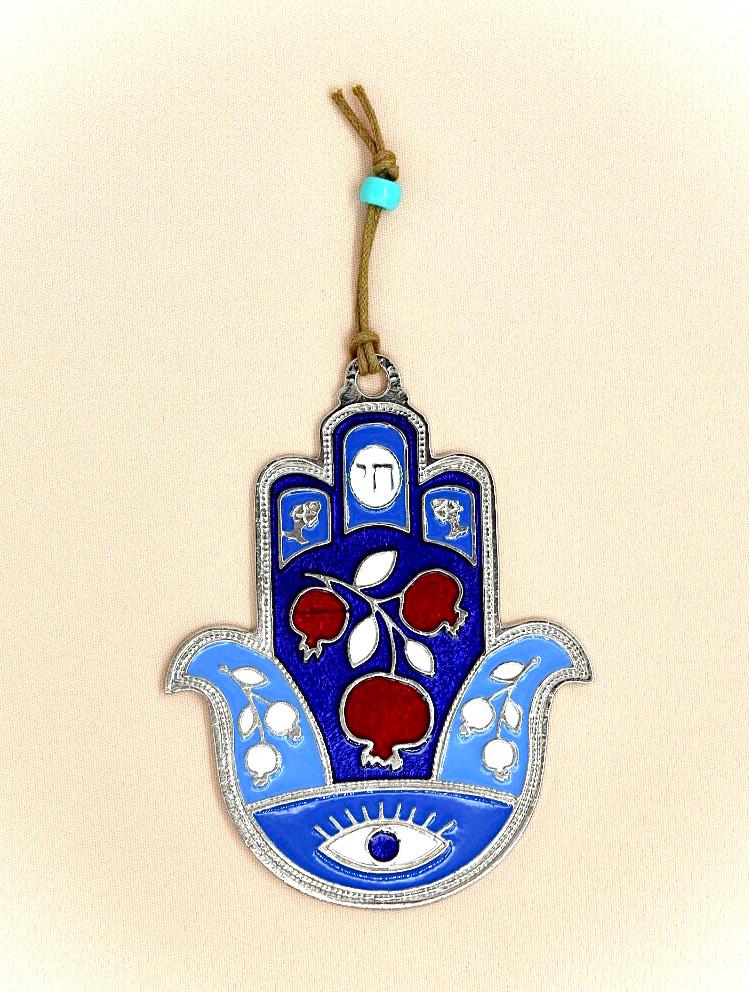 hamsa designed with pomegranate and an eye against the evil eye.