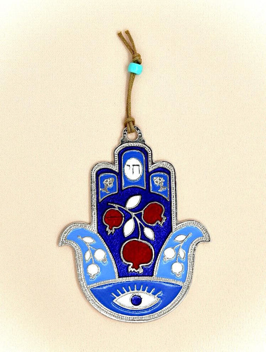 hamsa designed with pomegranate and an eye against the evil eye.