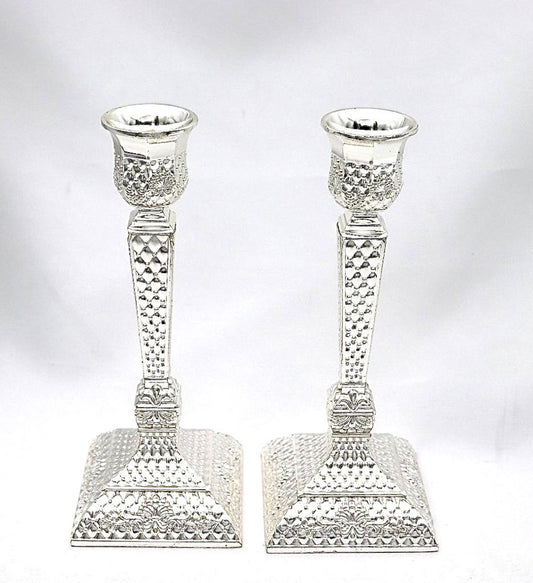 A pair of designed silver candlesticks