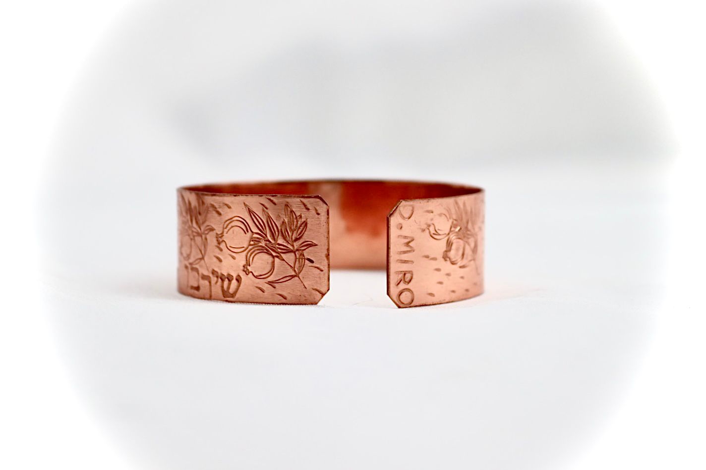 copper bracelet with pomegranate and blessing in Hebrew