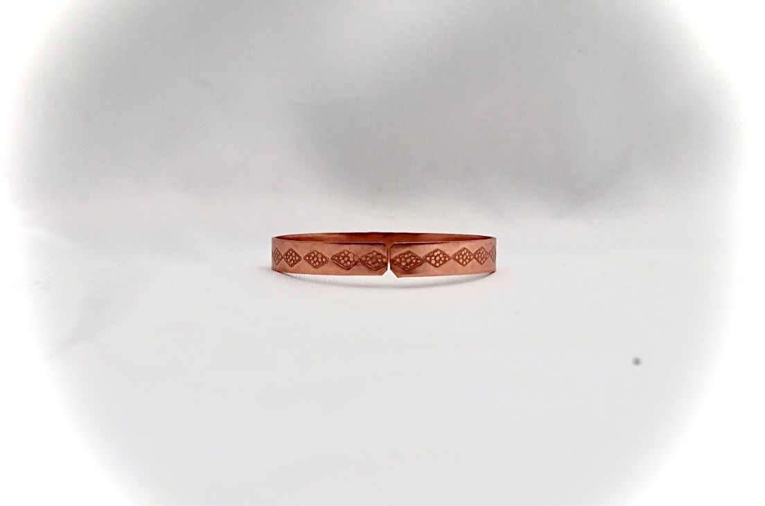 narrow copper bracelet. ״ love״