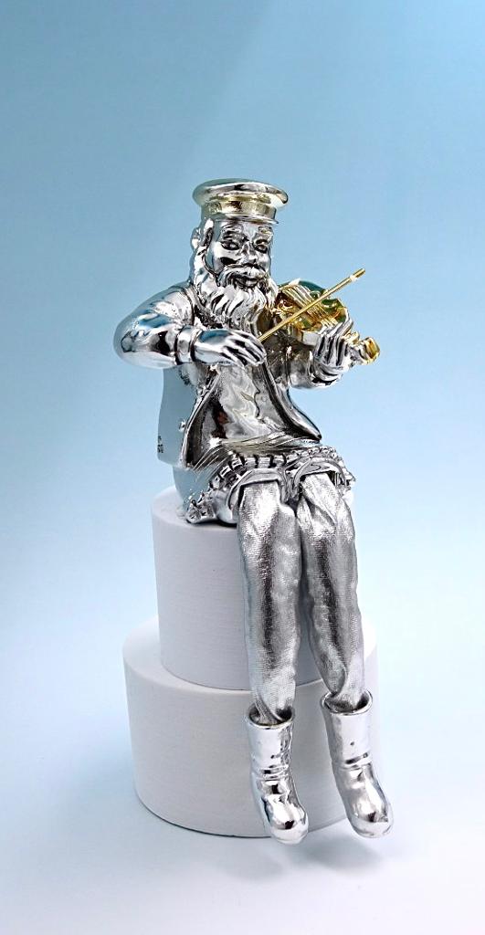 A seated Hasidic playing a violin, made of electroformed silver plating and gold plating.