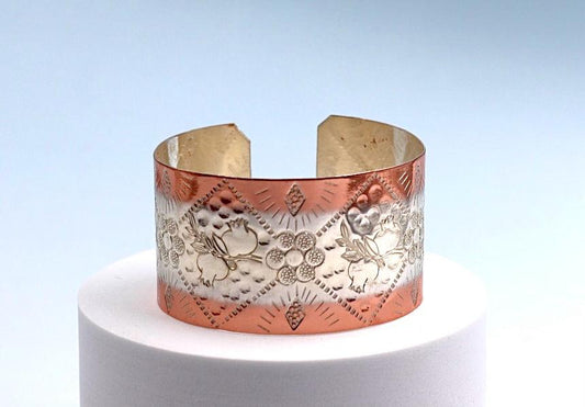 Copper and silver bracelet with pomegranate design