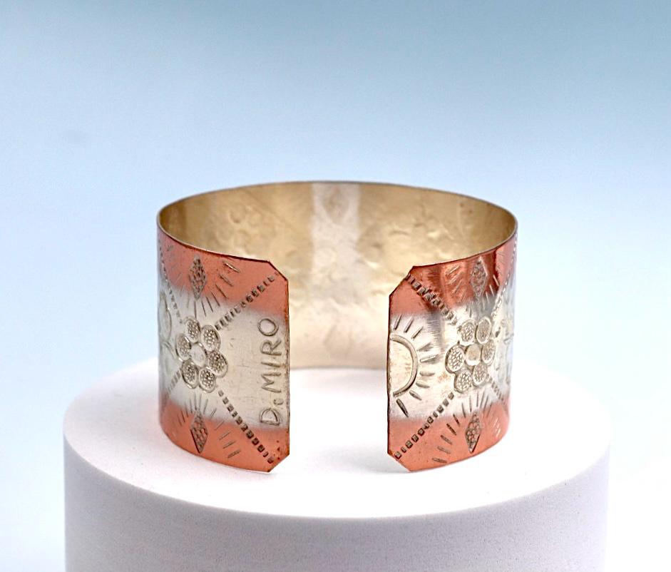 Copper and silver bracelet with pomegranate design