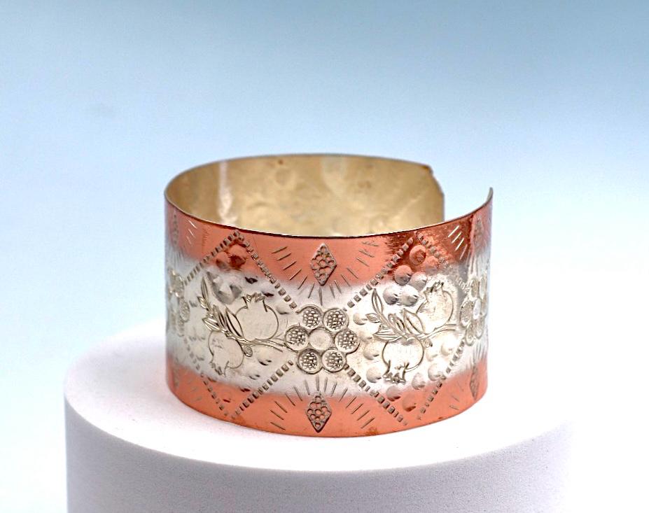 Copper and silver bracelet with pomegranate design