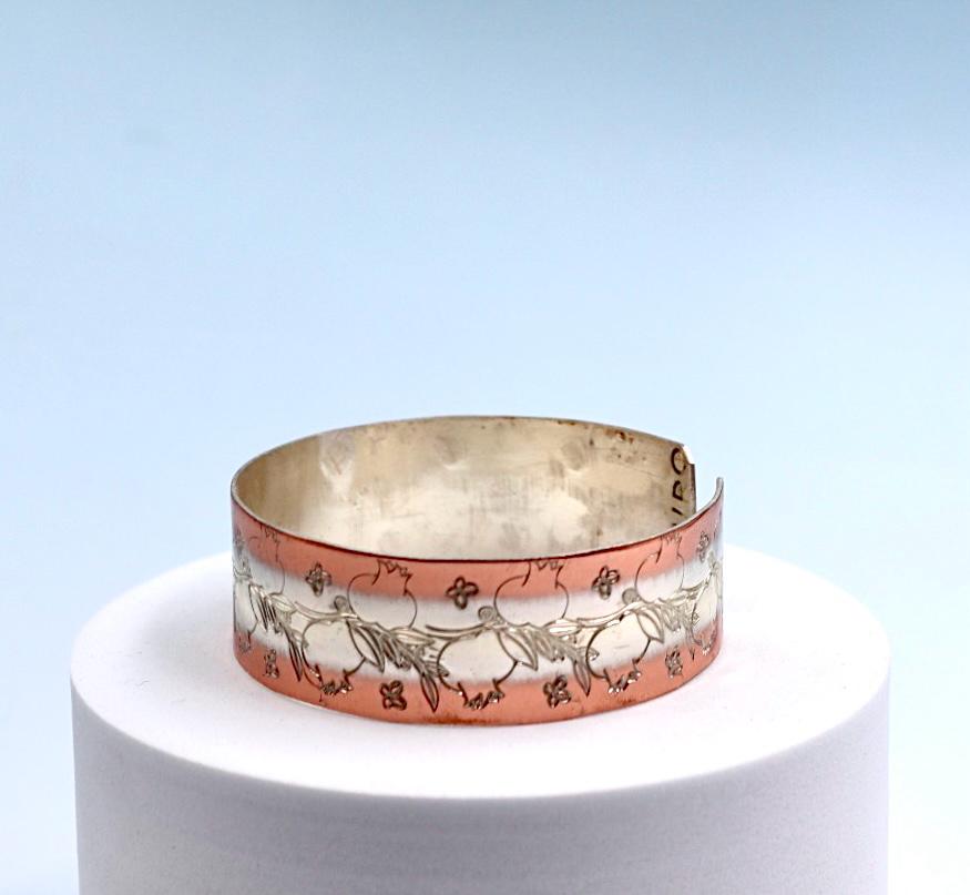 copper bracelet with silver engraved with pomegranates