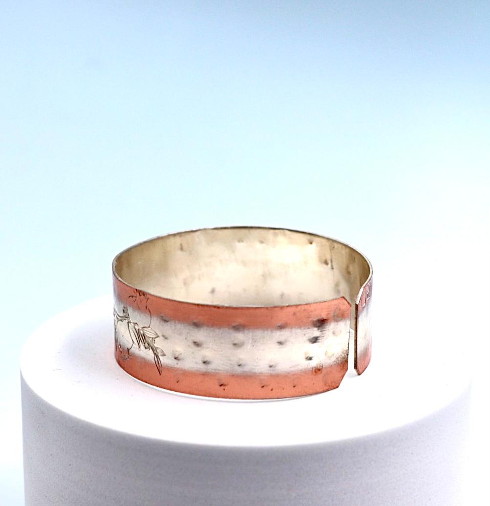 copper bracelet with silver engraved with pomegranates