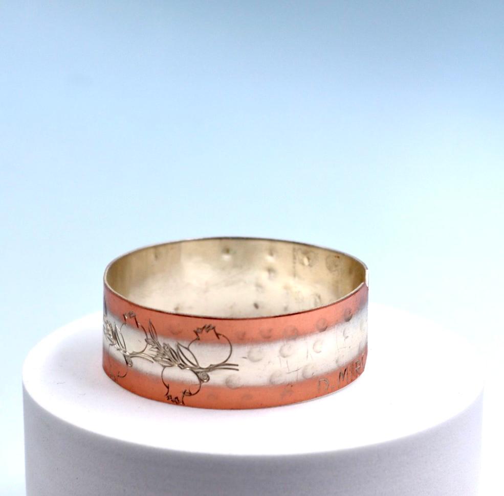 copper bracelet with silver engraved with pomegranates