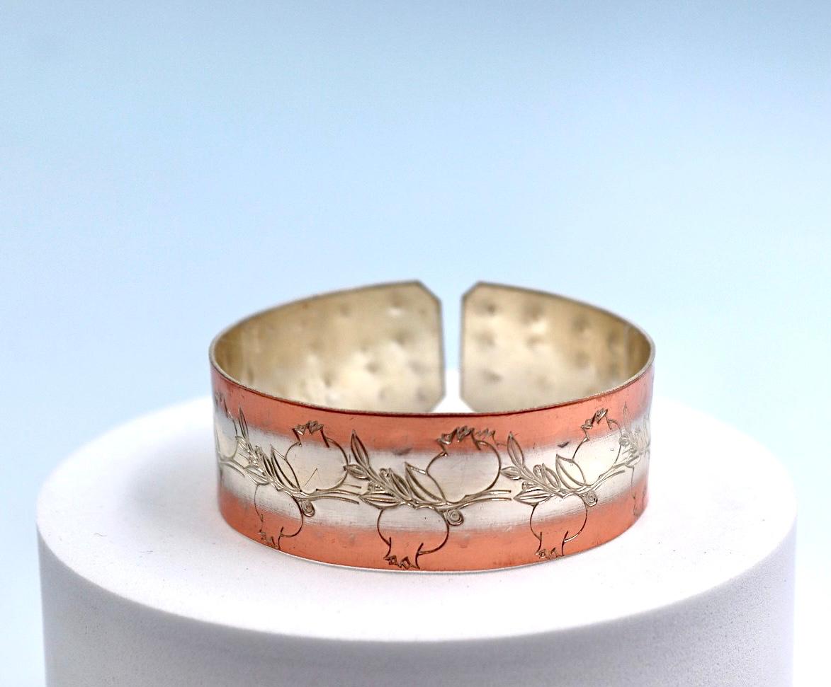 copper bracelet with silver engraved with pomegranates