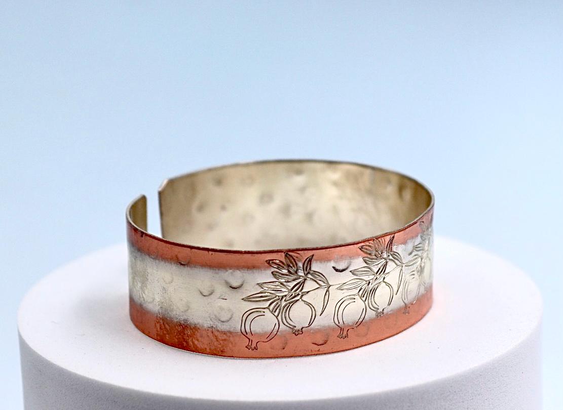 copper bracelet with silver engraved with pomegranates