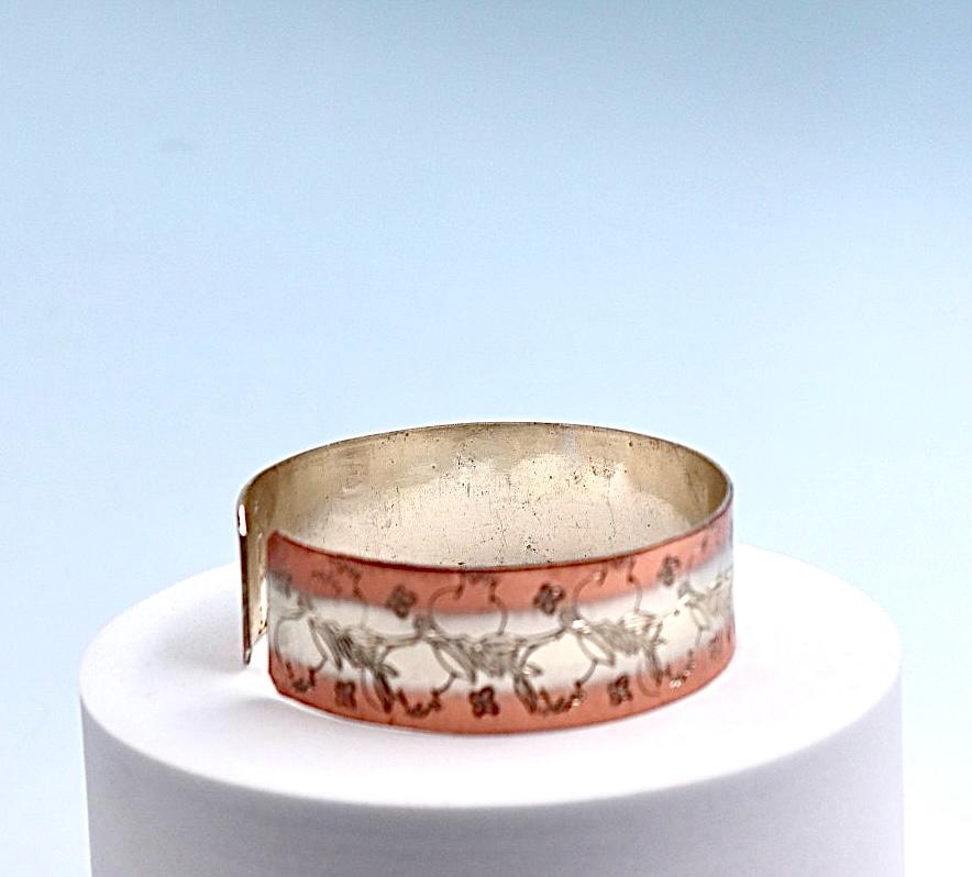 copper bracelet with silver engraved with pomegranates