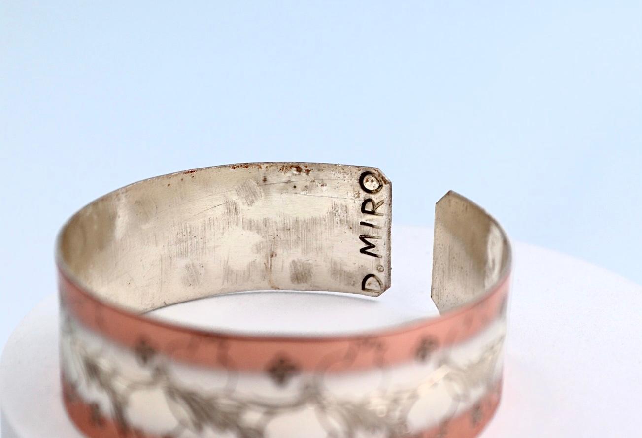 copper bracelet with silver engraved with pomegranates