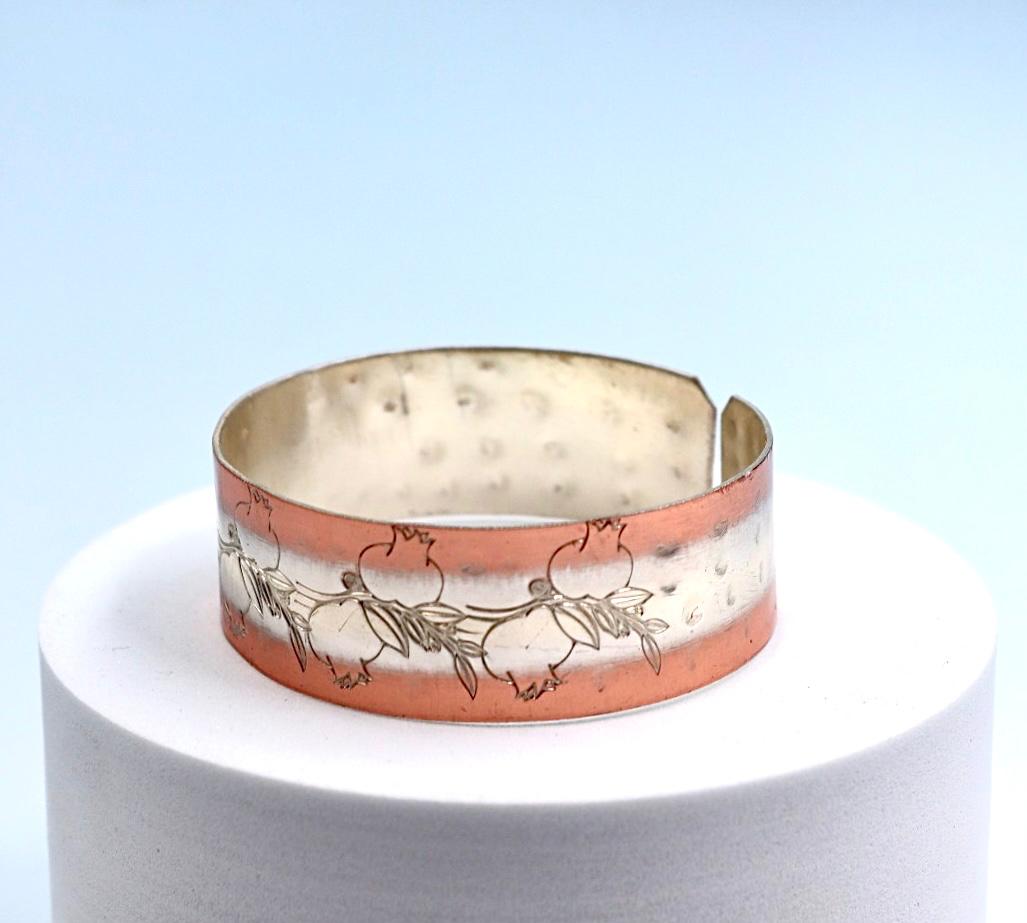 copper bracelet with silver engraved with pomegranates