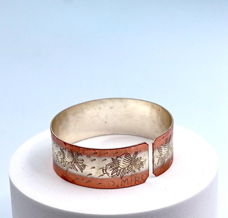 copper bracelet with silver engraved with pomegranates