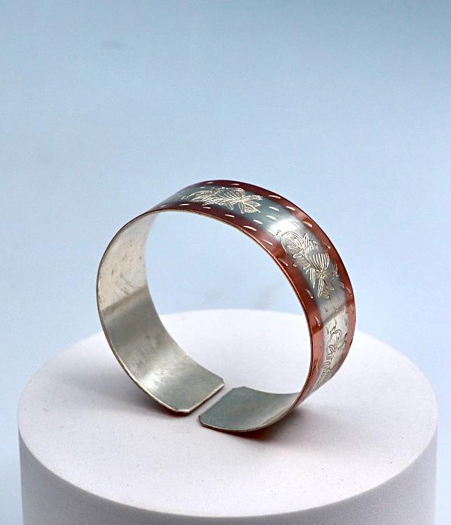 copper bracelet with silver engraved with pomegranates