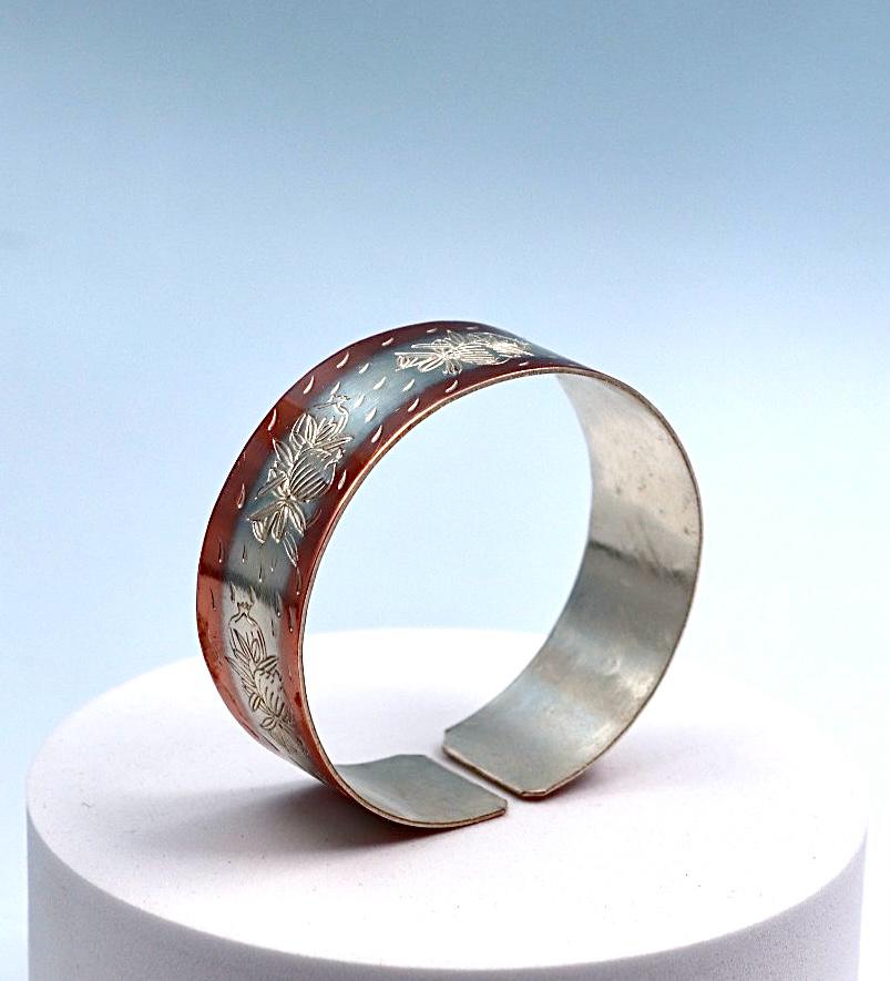 copper bracelet with silver engraved with pomegranates