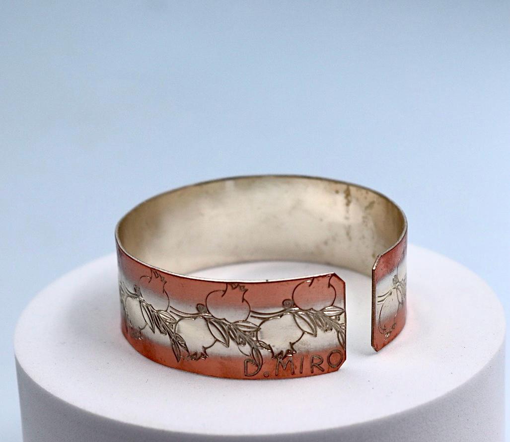 copper bracelet with silver engraved with pomegranates