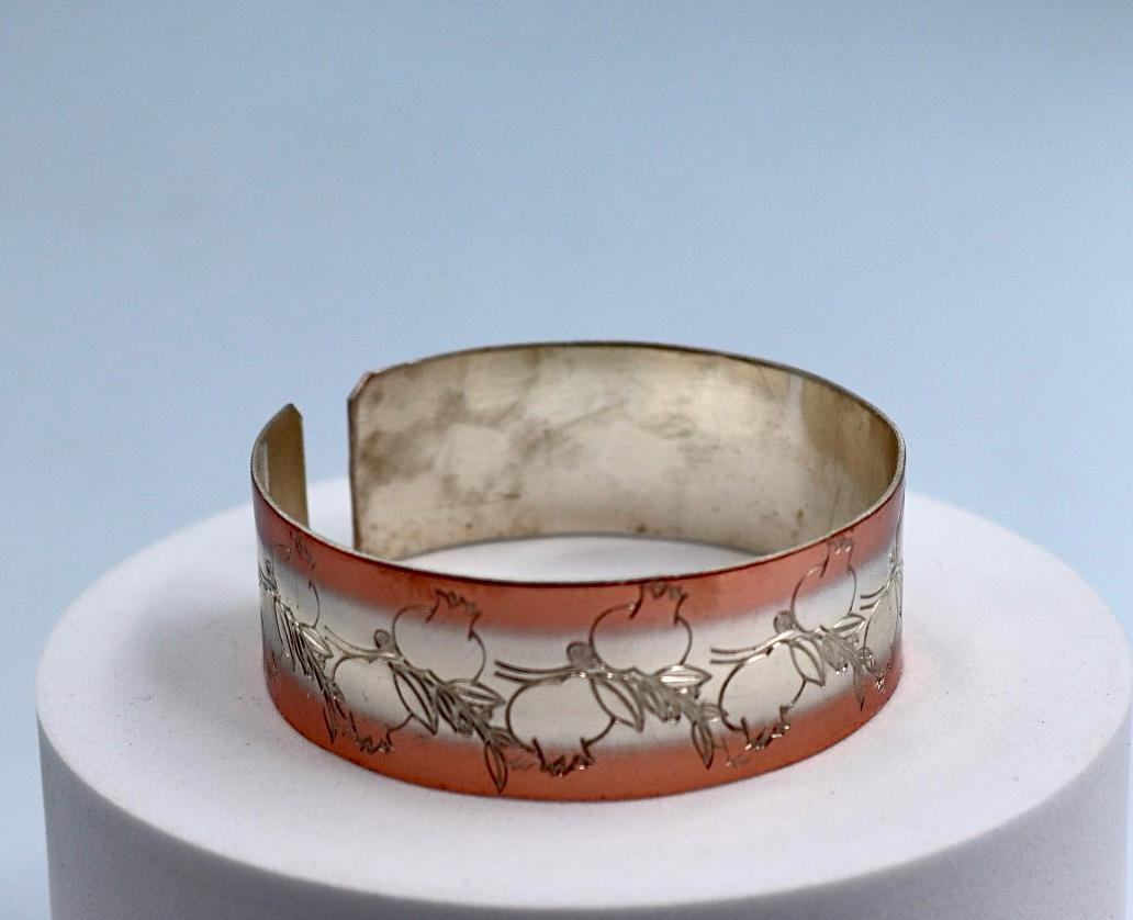 copper bracelet with silver engraved with pomegranates