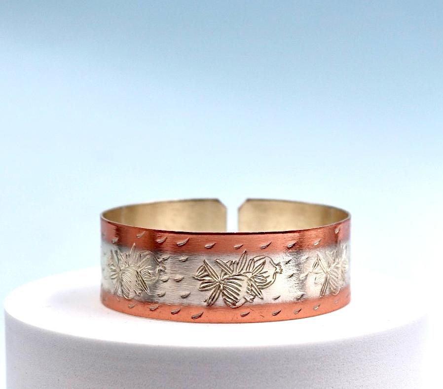 copper bracelet with silver engraved with pomegranates