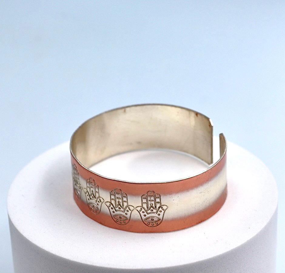 copper bracelet with silver engraved with Hamsa