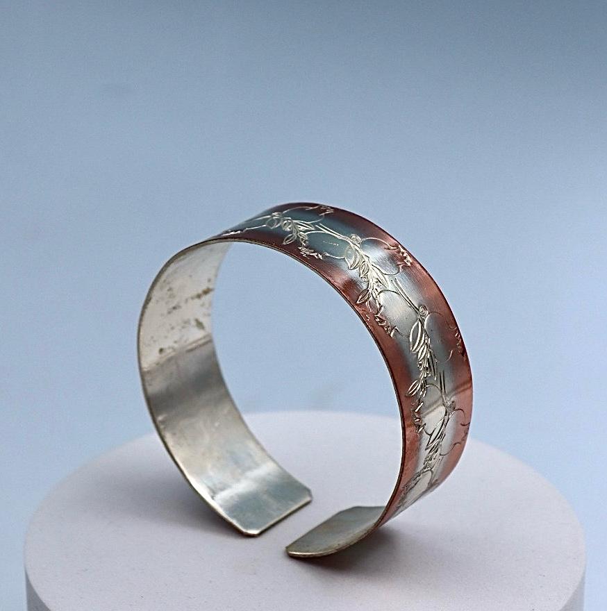 copper bracelet with silver engraved with pomegranates