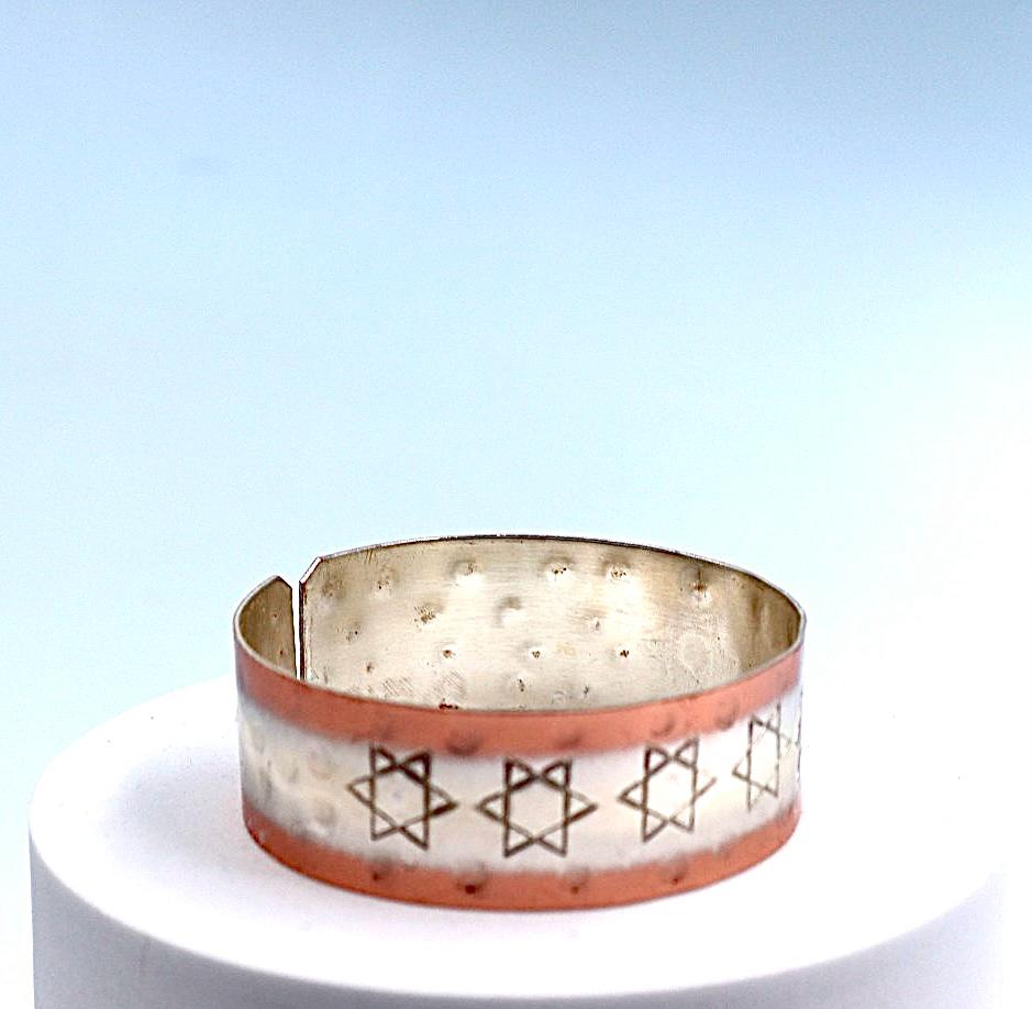 copper bracelet with silver engraved with Star of David .