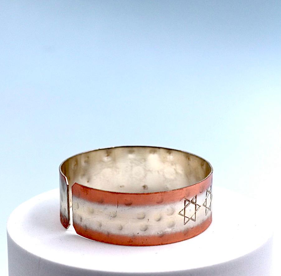 copper bracelet with silver engraved with Star of David .