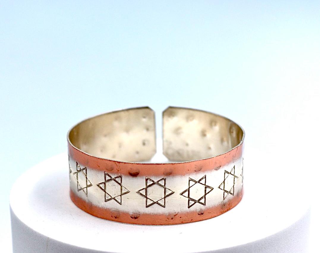 copper bracelet with silver engraved with Star of David .