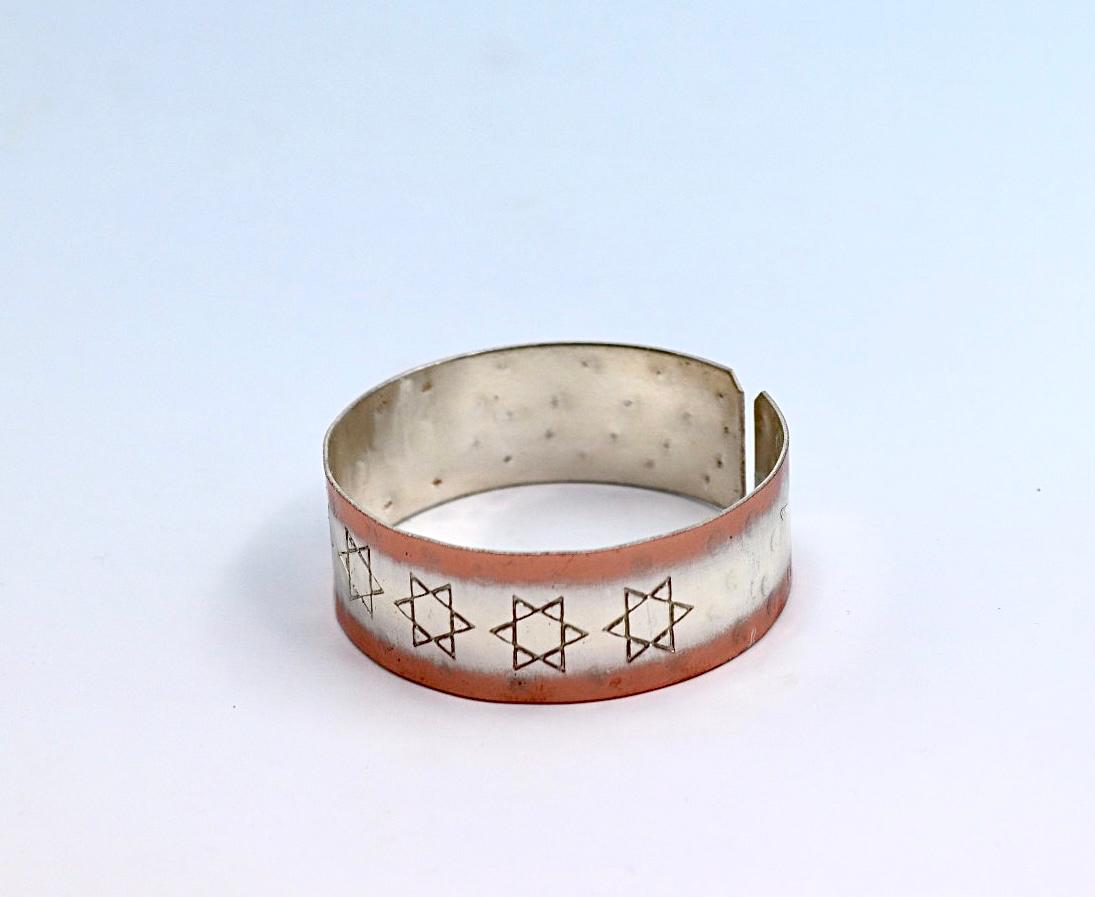 copper bracelet with silver engraved with Star of David .