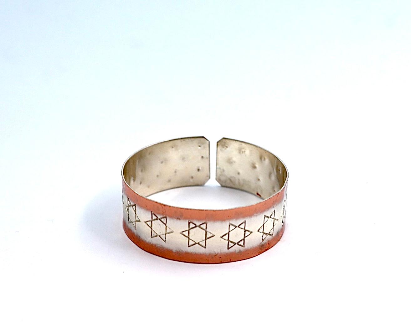 copper bracelet with silver engraved with Star of David .