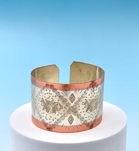 copper bracelet with pomegranates. partly silver-plated.