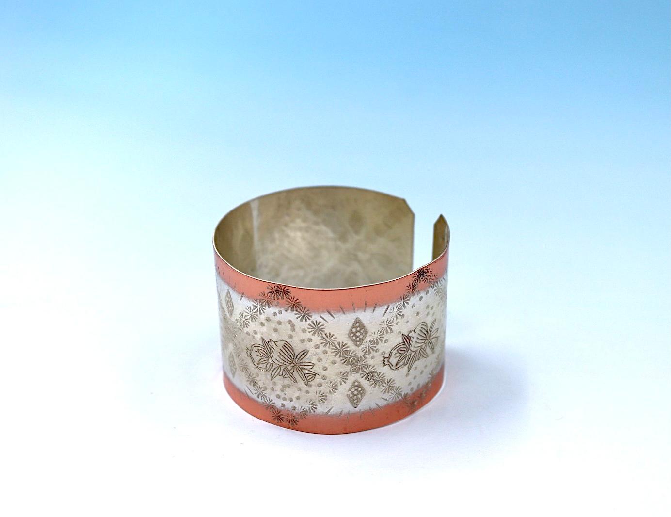 copper bracelet with pomegranates. partly silver-plated.