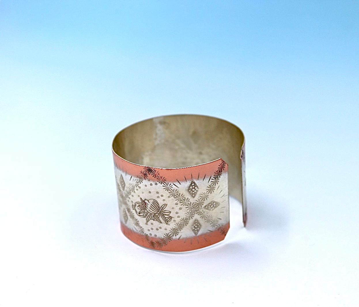 copper bracelet with pomegranates. partly silver-plated.