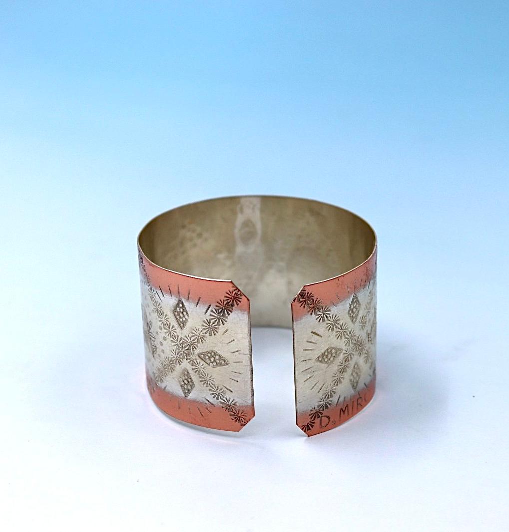 copper bracelet with pomegranates. partly silver-plated.