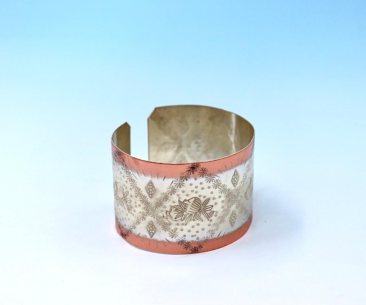 copper bracelet with pomegranates. partly silver-plated.