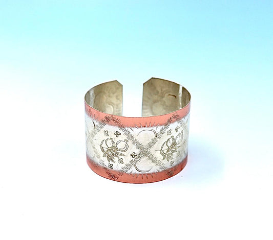 copper bracelet with pomegranates, partly silver-plated.